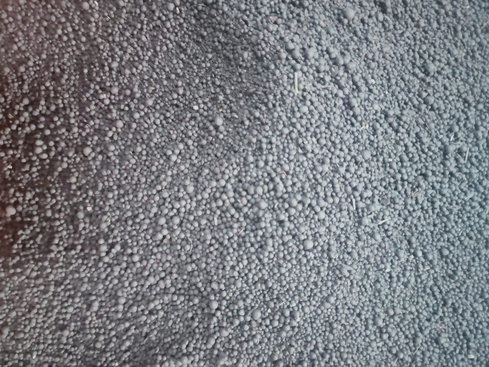 Sludge composting facility with mixing and aeration systems